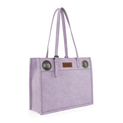 Purple tote bag with decorativeconchos on a white background