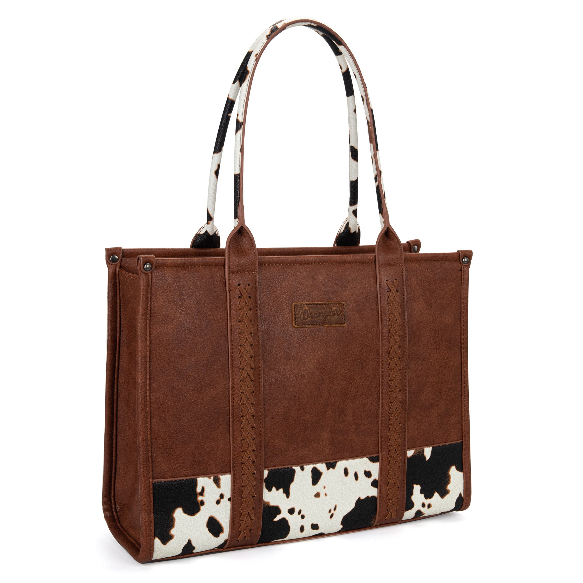 Wrangler cow print purse in color brown  with concealed carry pocket, whipstitch details, and signature Wrangler logo. Secure zipper top. Stylish & functional.
