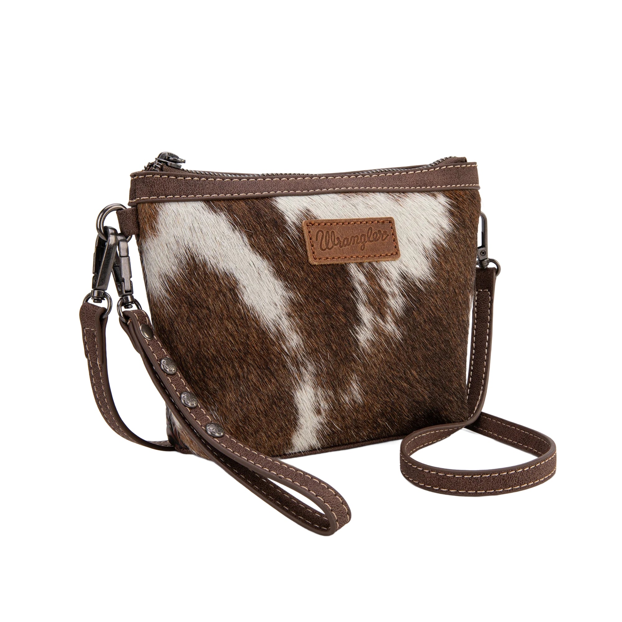 Wrangler crossbody wristlet bag made of genuine hair-on cowhide with brown PU leather trim and detachable strap.
