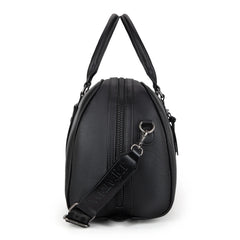 Side look of Black Wrangler duffle bag with whipstitch details, PU leather material, top zipper, front pocket, and detachable guitar-style shoulder strap.
